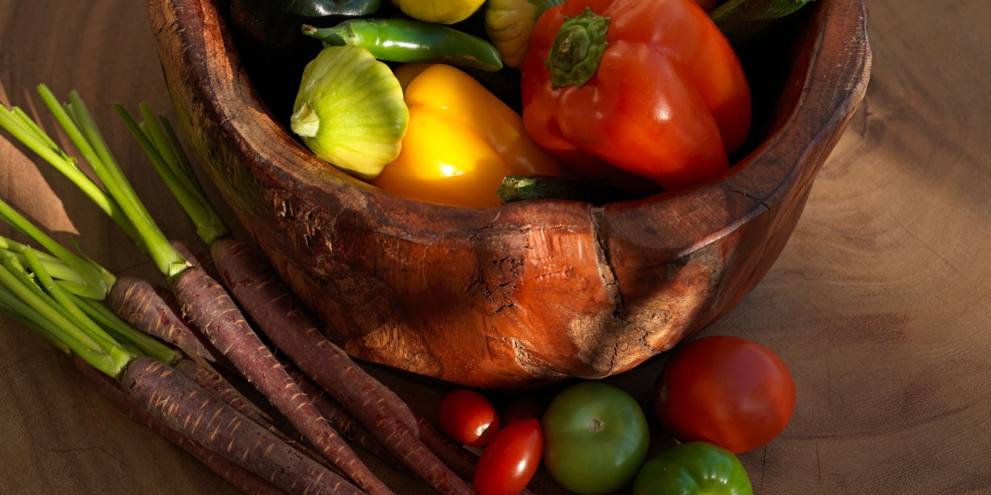 a bowl of vegetables on a table