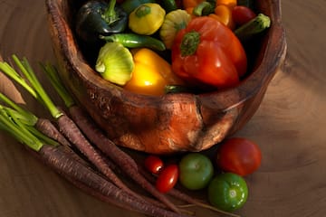 a bowl of vegetables on a table