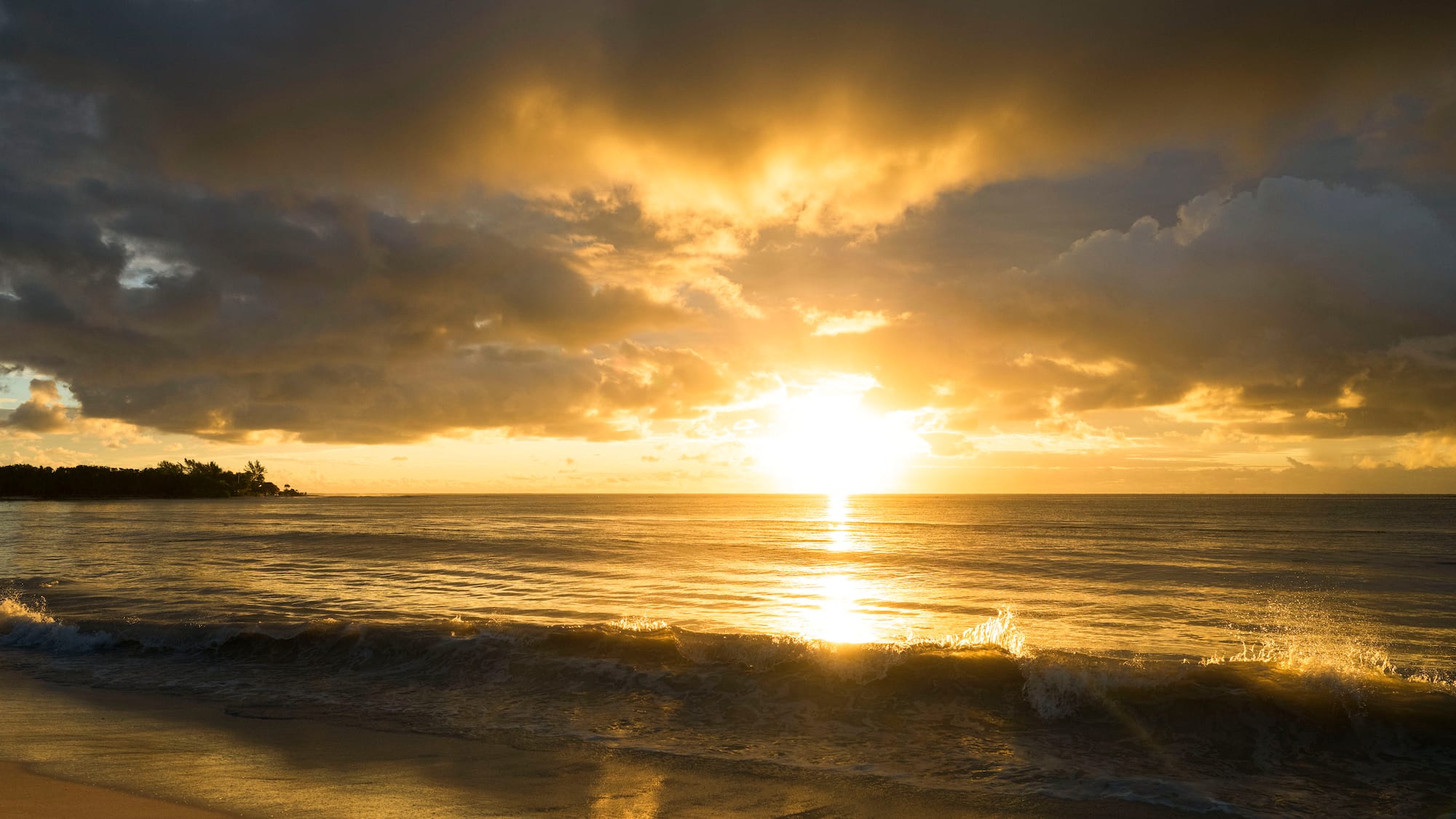 a sunset over a beach