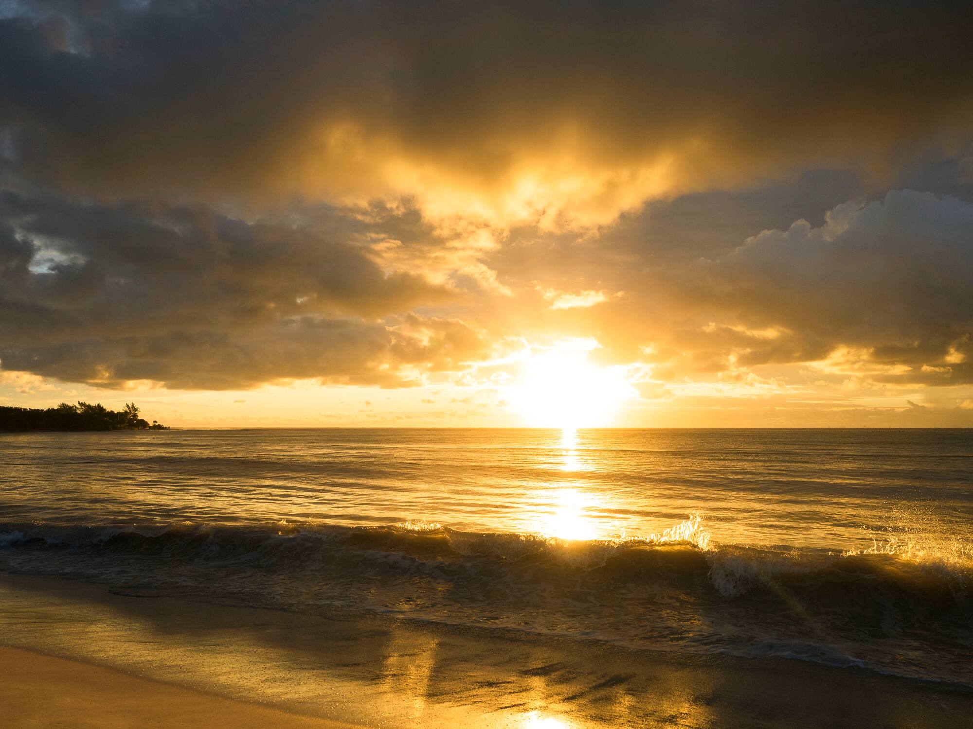 a sunset over a beach