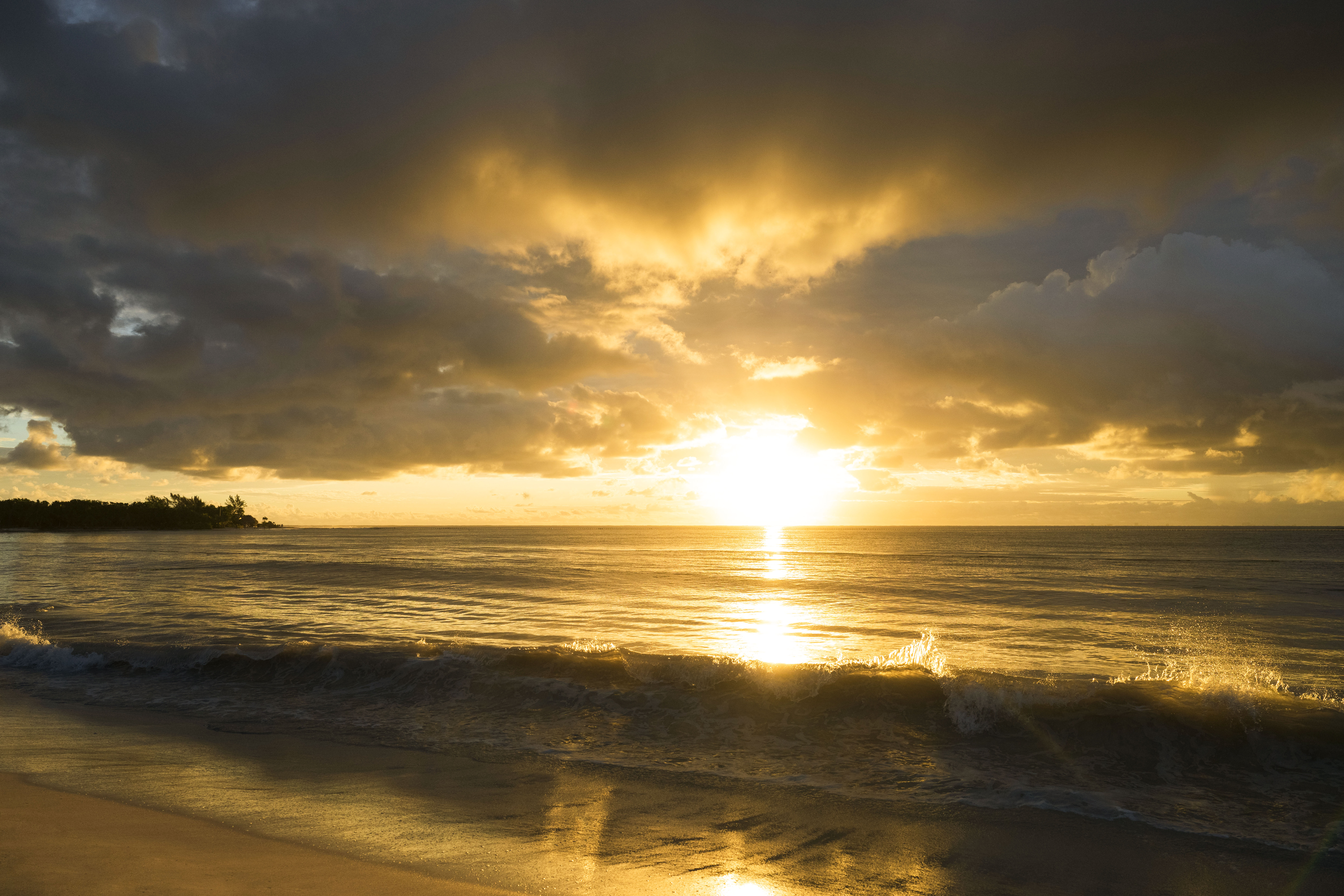 a sunset over a beach