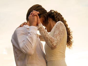 a man and woman holding hands