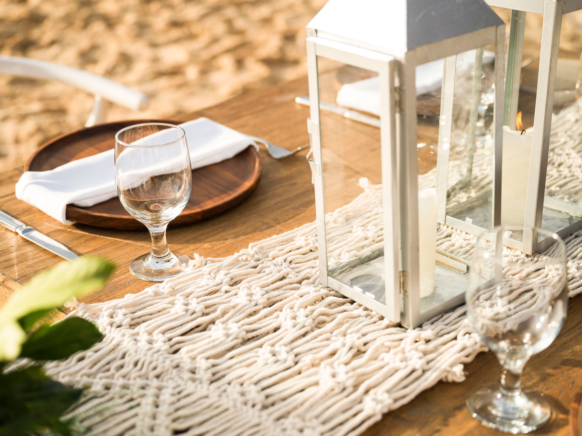 a table with a lantern and wine glasses on it