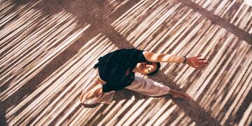 a woman doing yoga on the ground