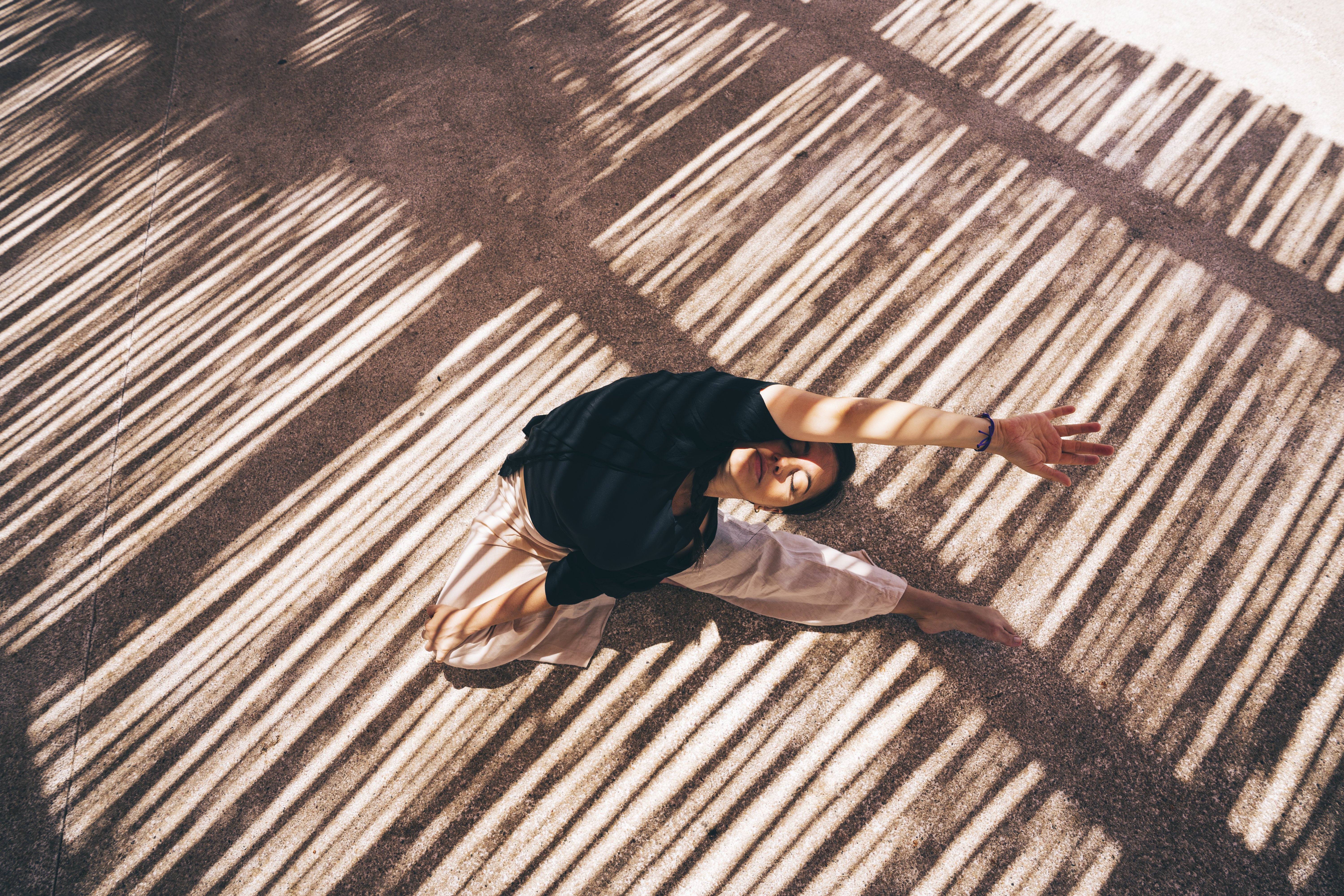 a woman doing yoga on the ground
