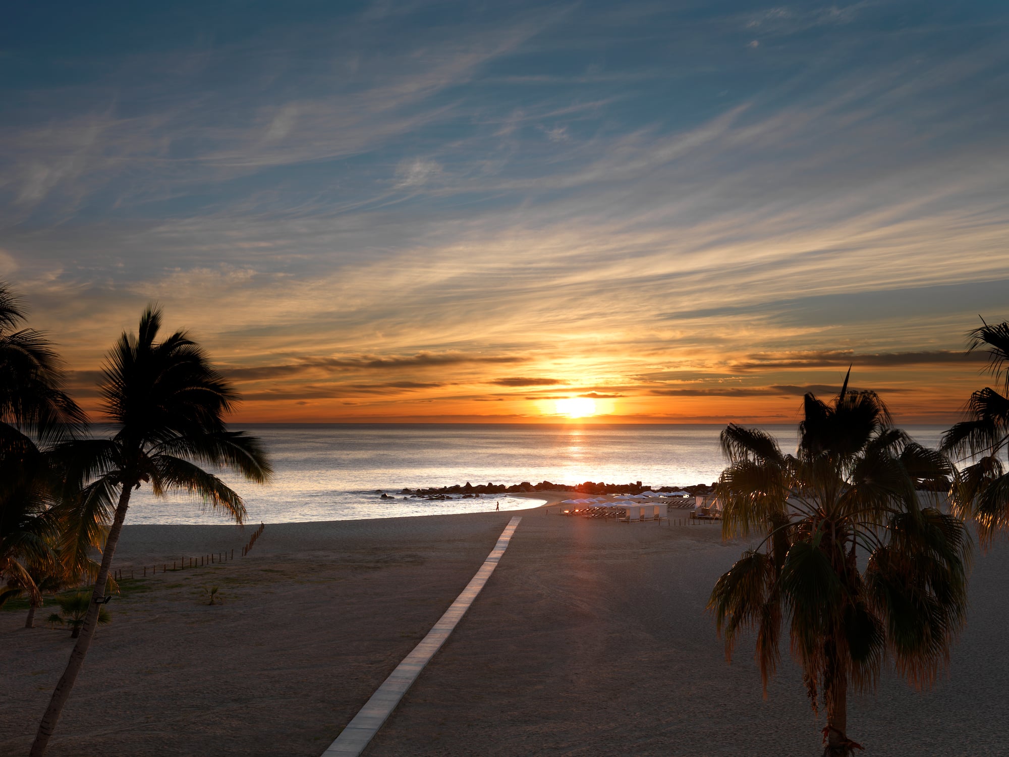 a sunset over a beach