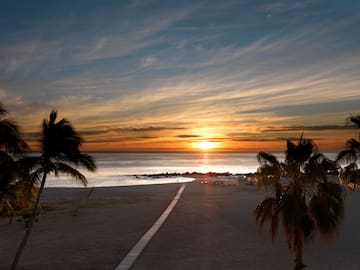 a sunset over a beach
