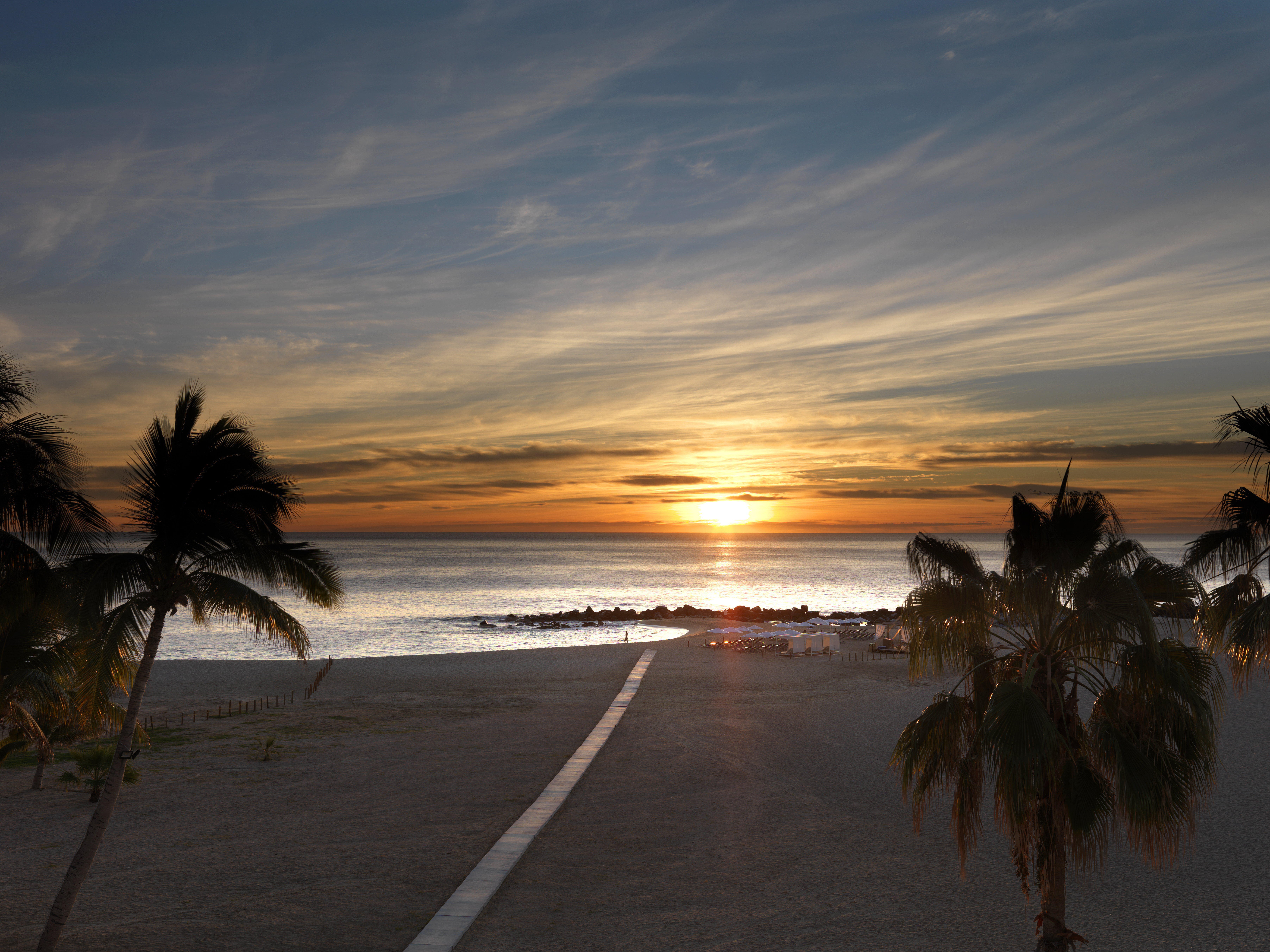 a sunset over a beach
