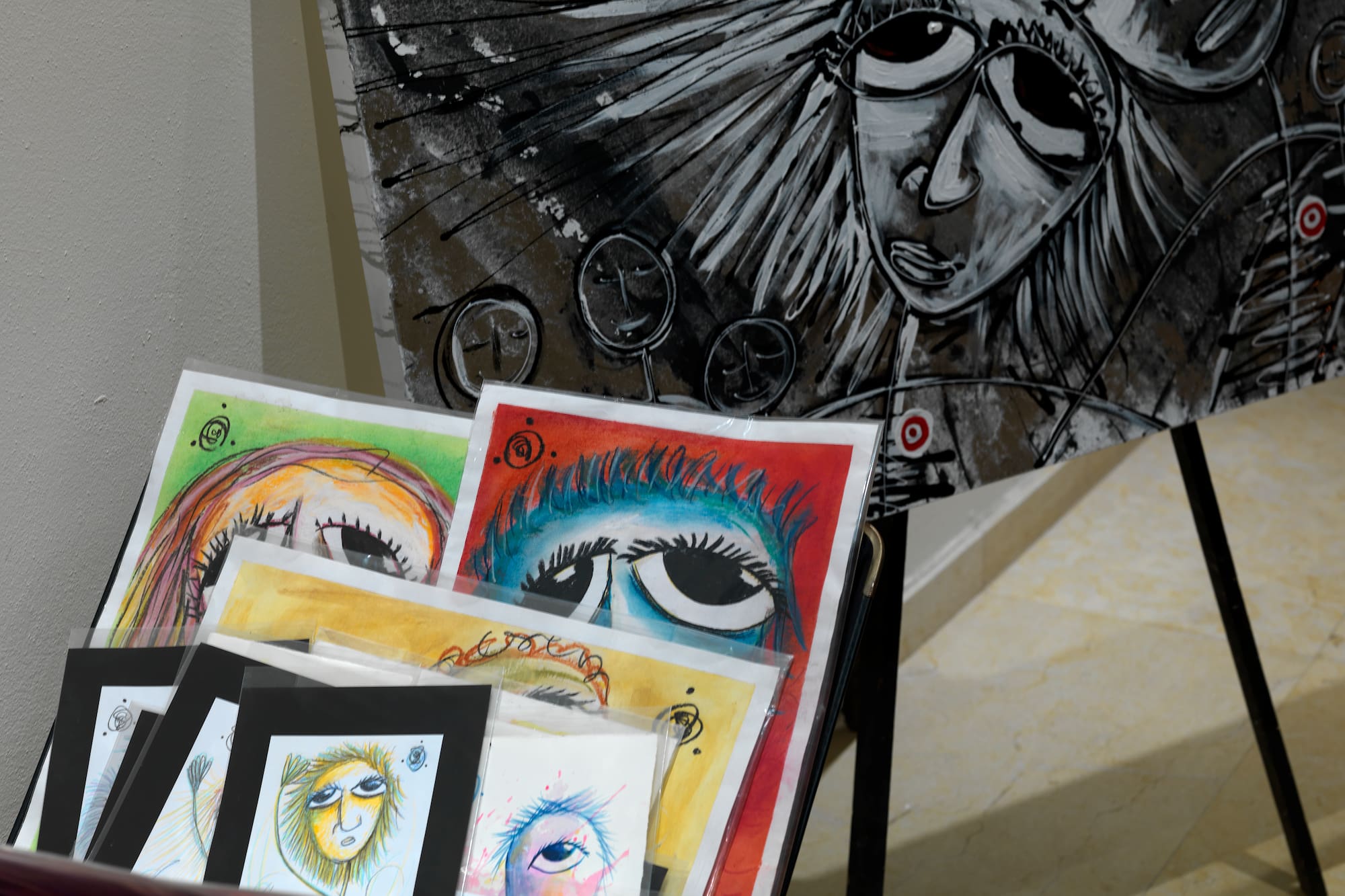 a group of art pieces on a stand