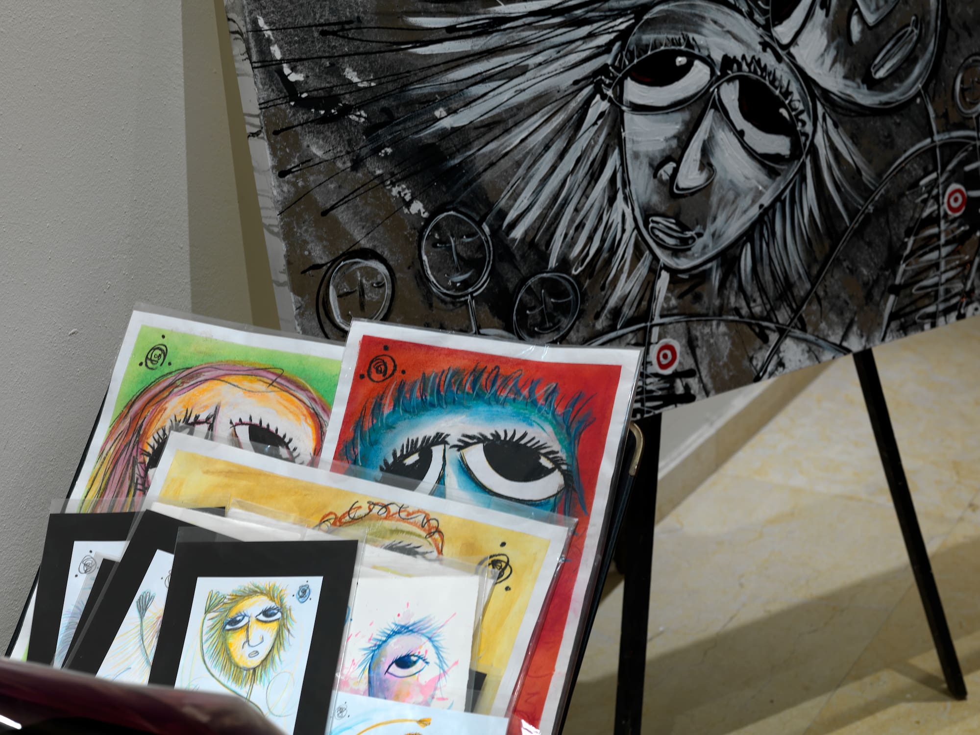 a group of art pieces on a stand