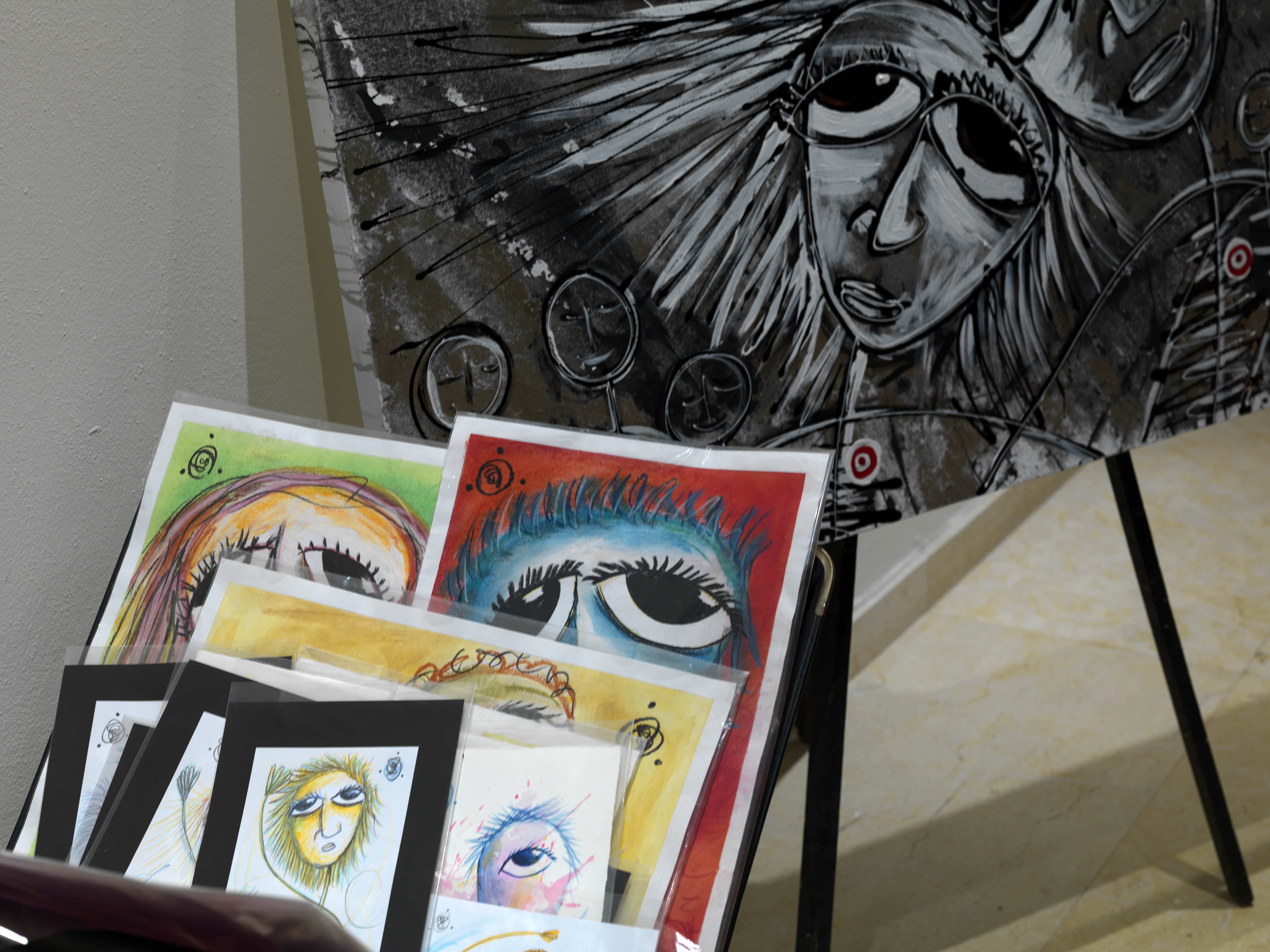 a group of art pieces on a stand