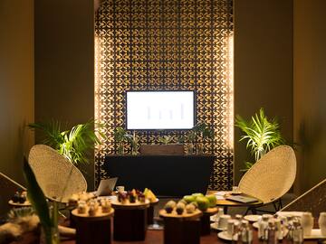 a room with a television and a table with food