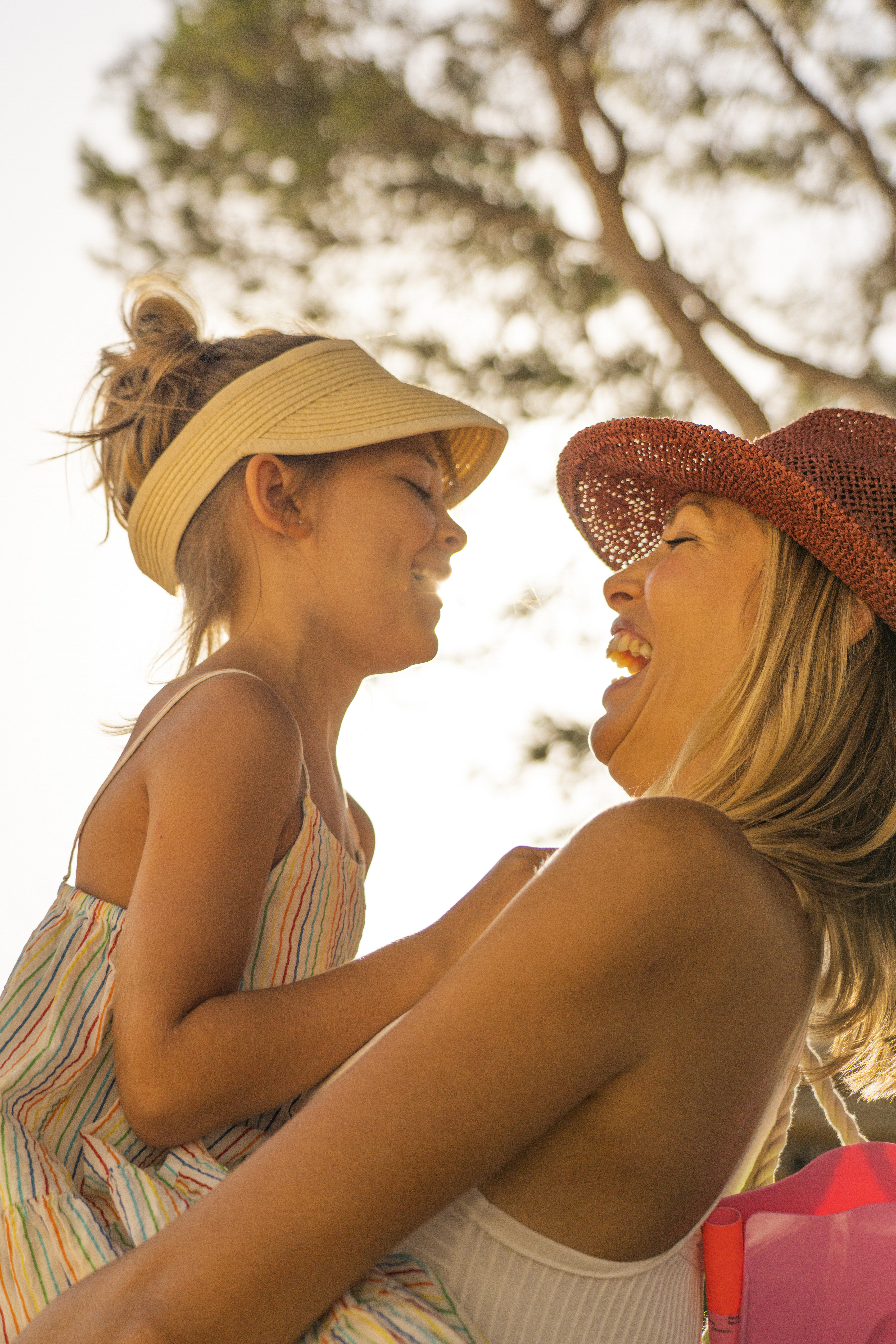 a woman holding a child in her arms