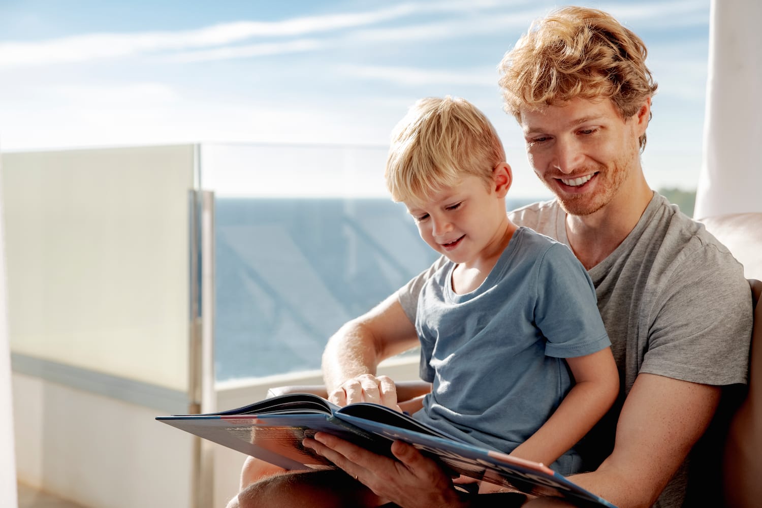 a man and child reading a book