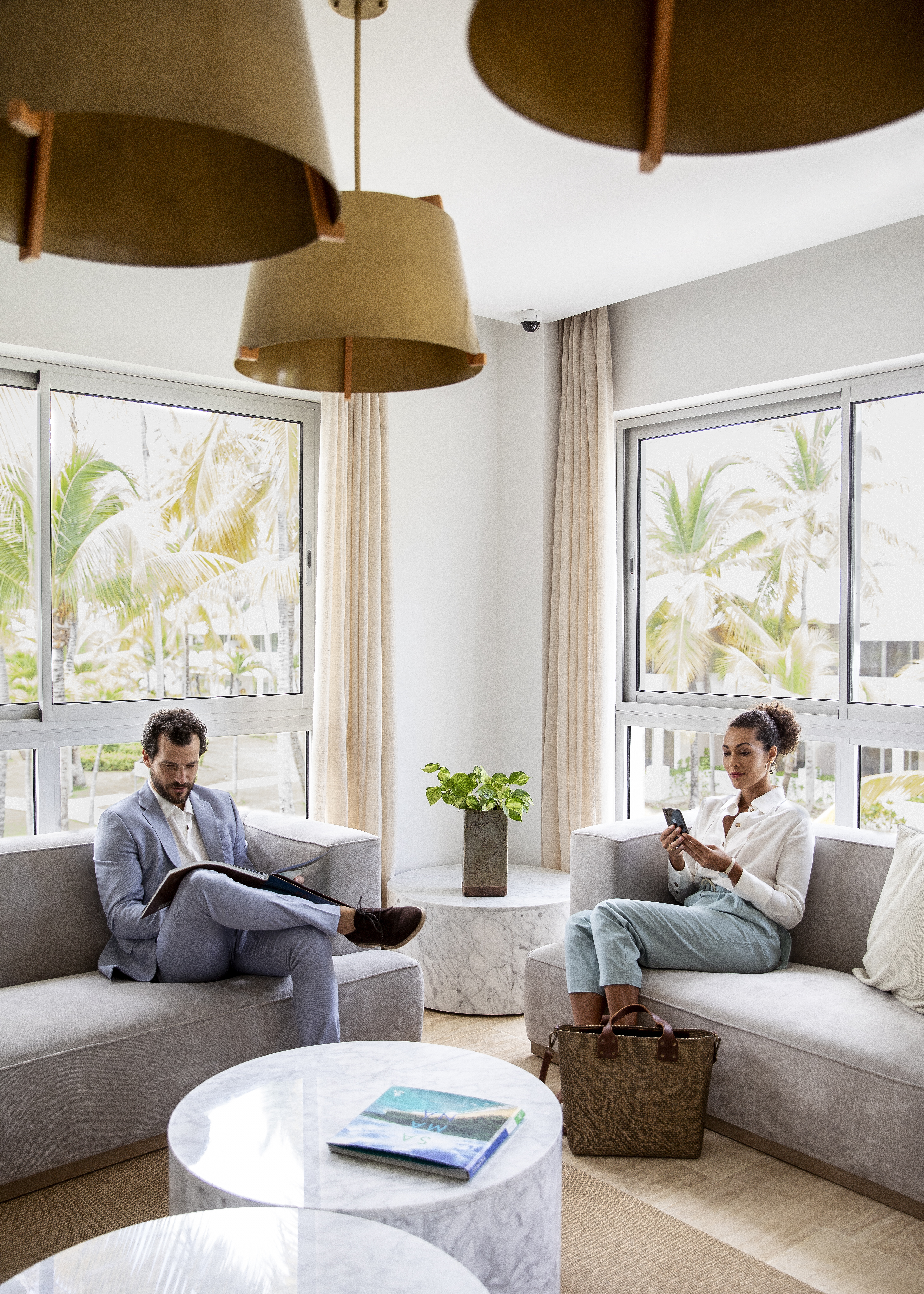 a man and woman sitting on couches in a room