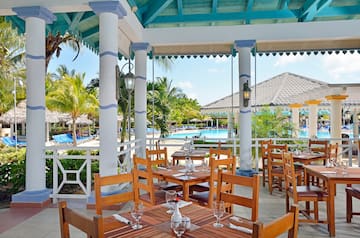 a restaurant with tables and chairs