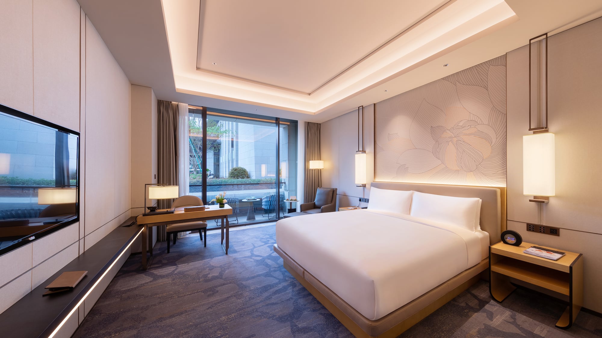 a room with a bed and a desk