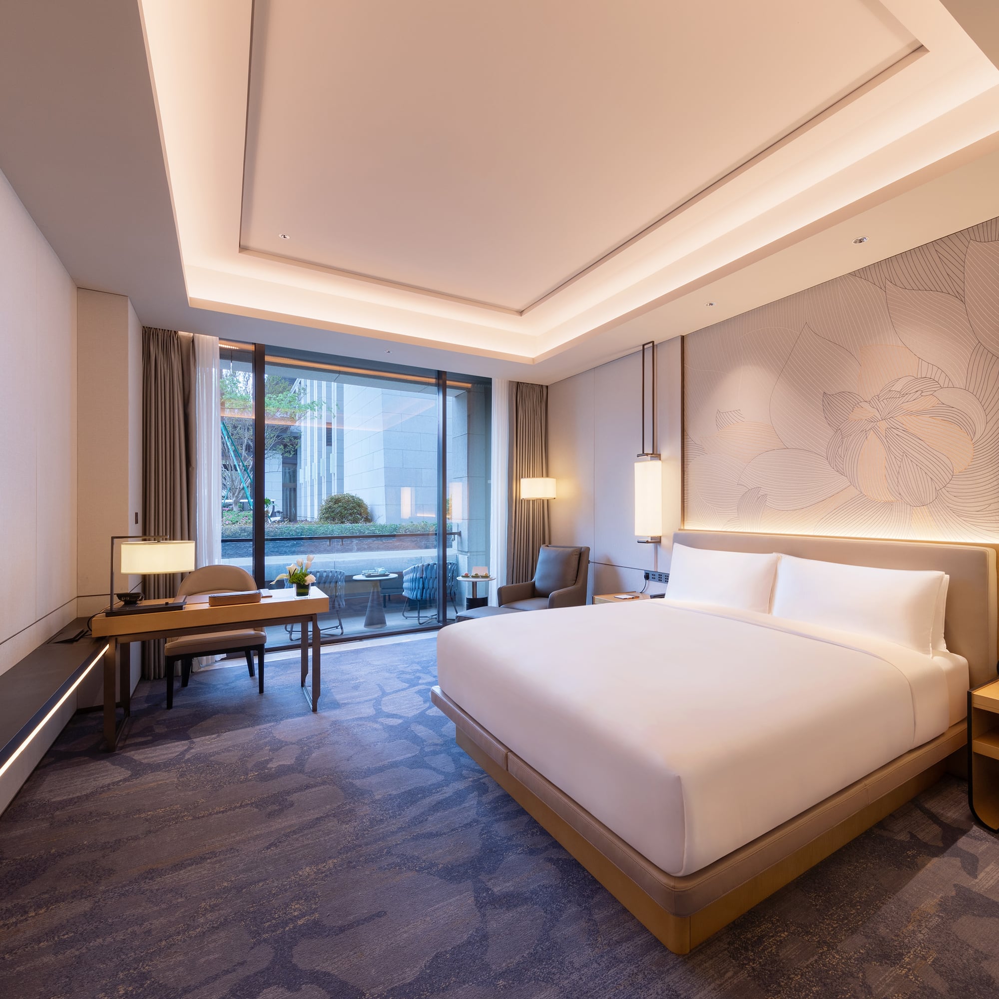 a room with a bed and a desk