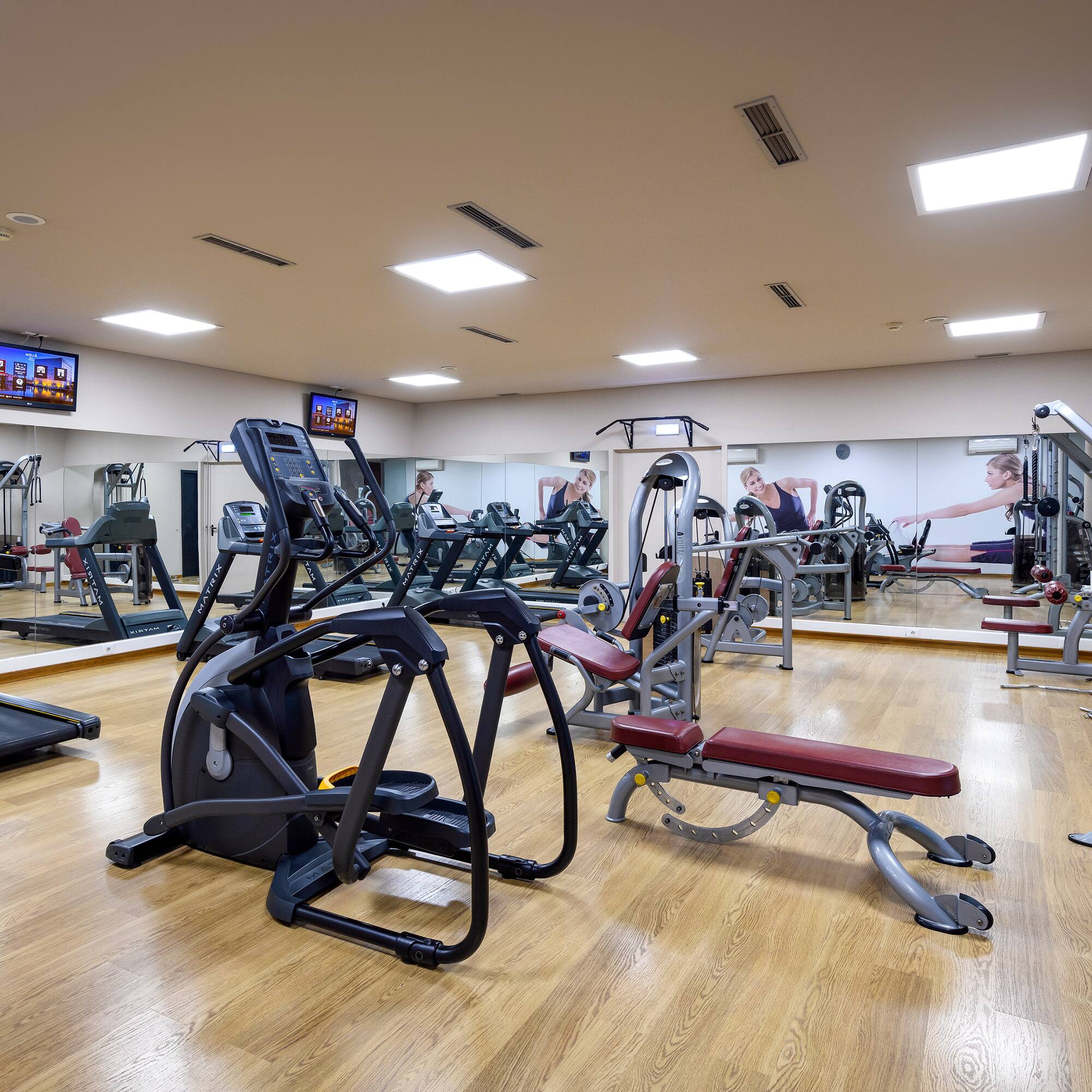 a large room with exercise equipment