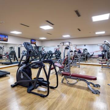 a large room with exercise equipment