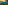 a green hills with trees and a sunset