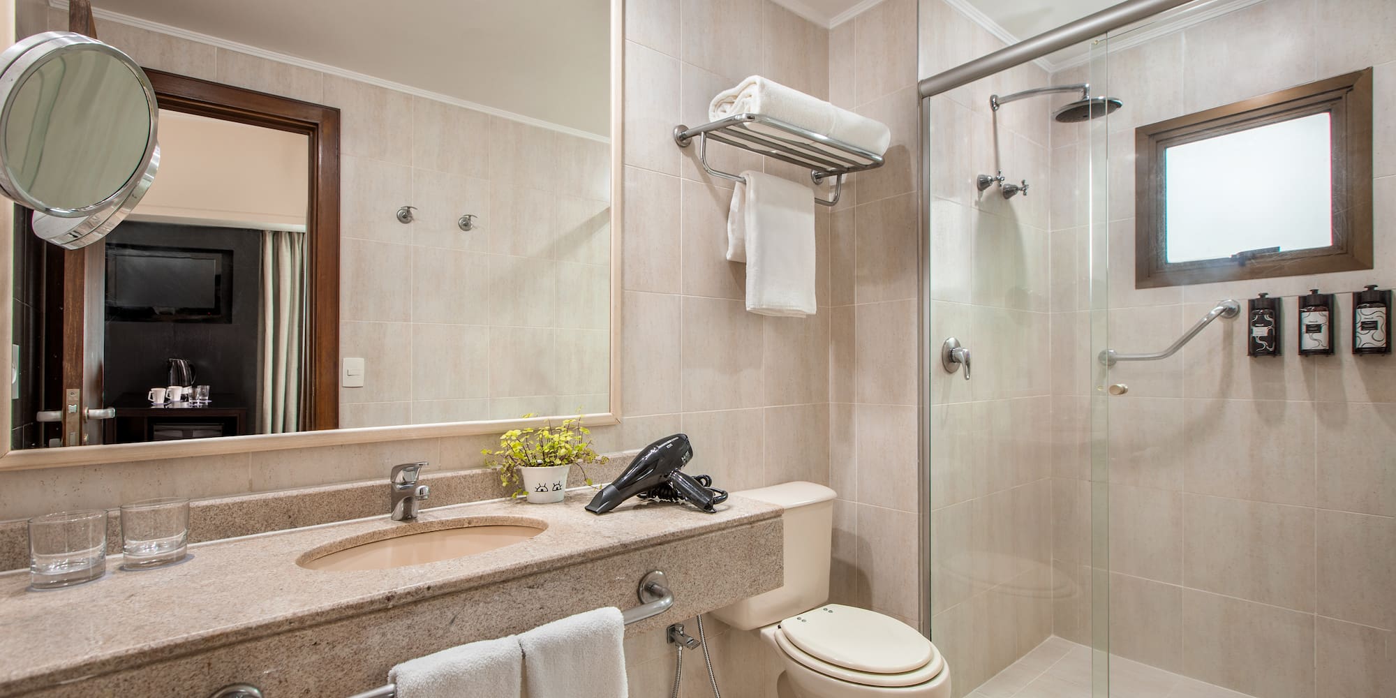 a bathroom with a shower and sink