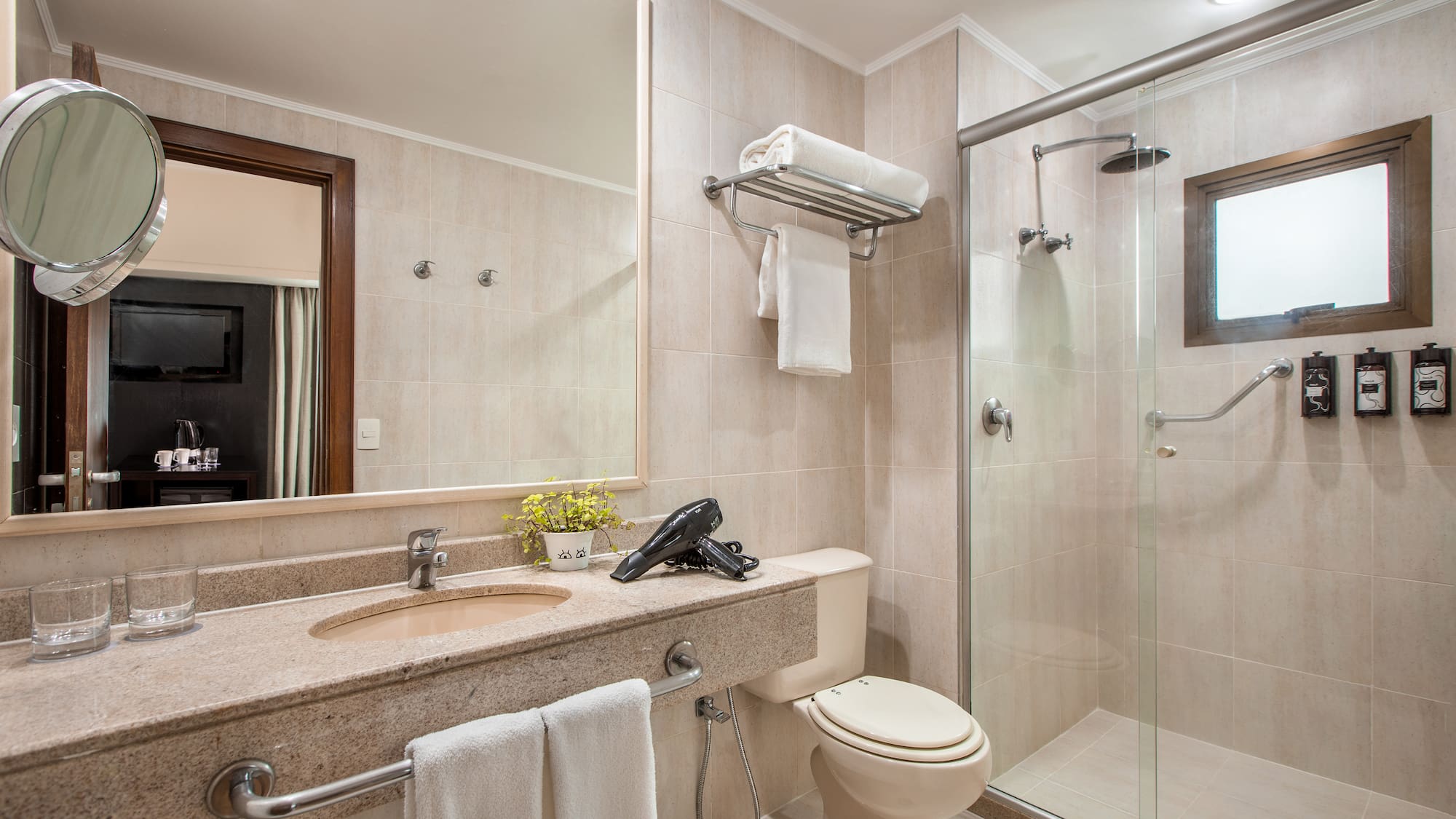 a bathroom with a shower and sink