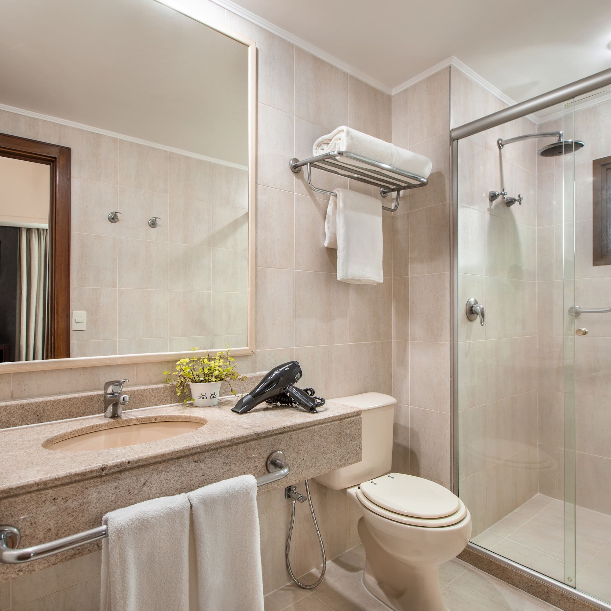 a bathroom with a shower and sink