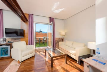 a living room with a glass door and a couch