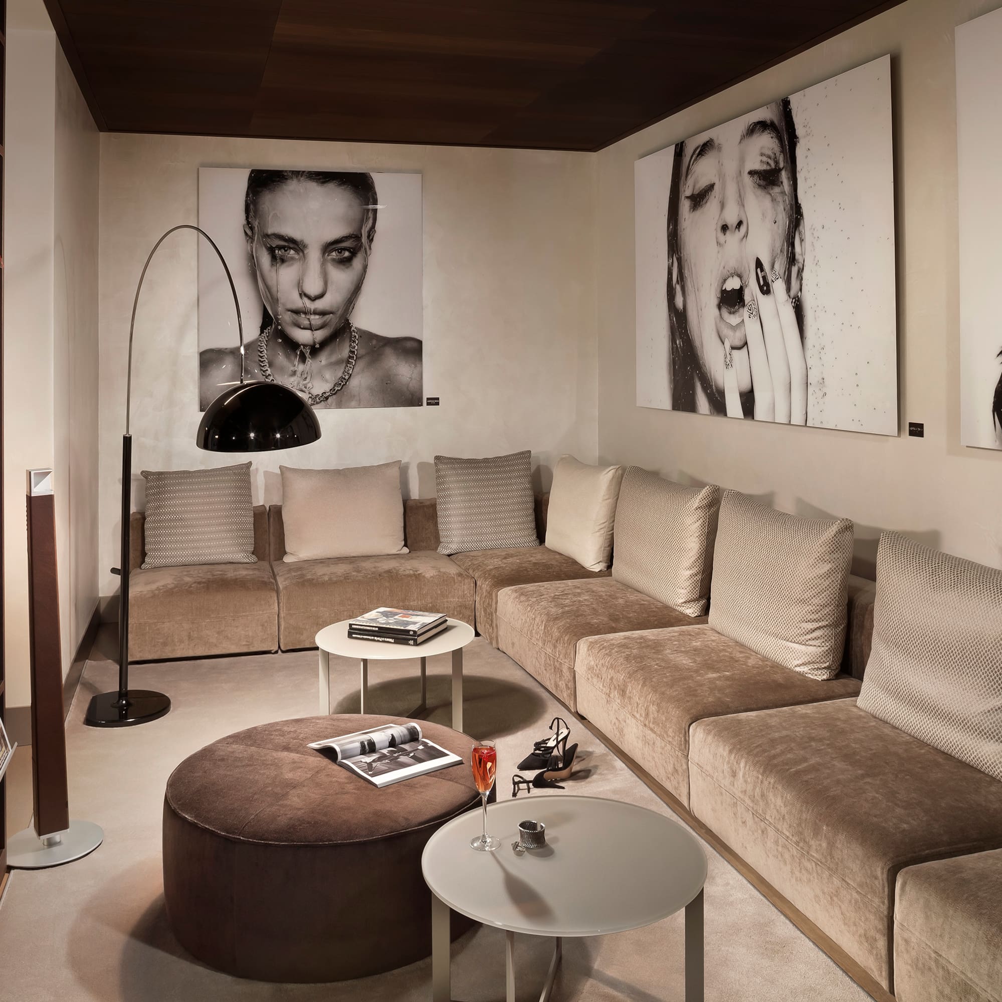 a living room with a couch and pictures on the wall