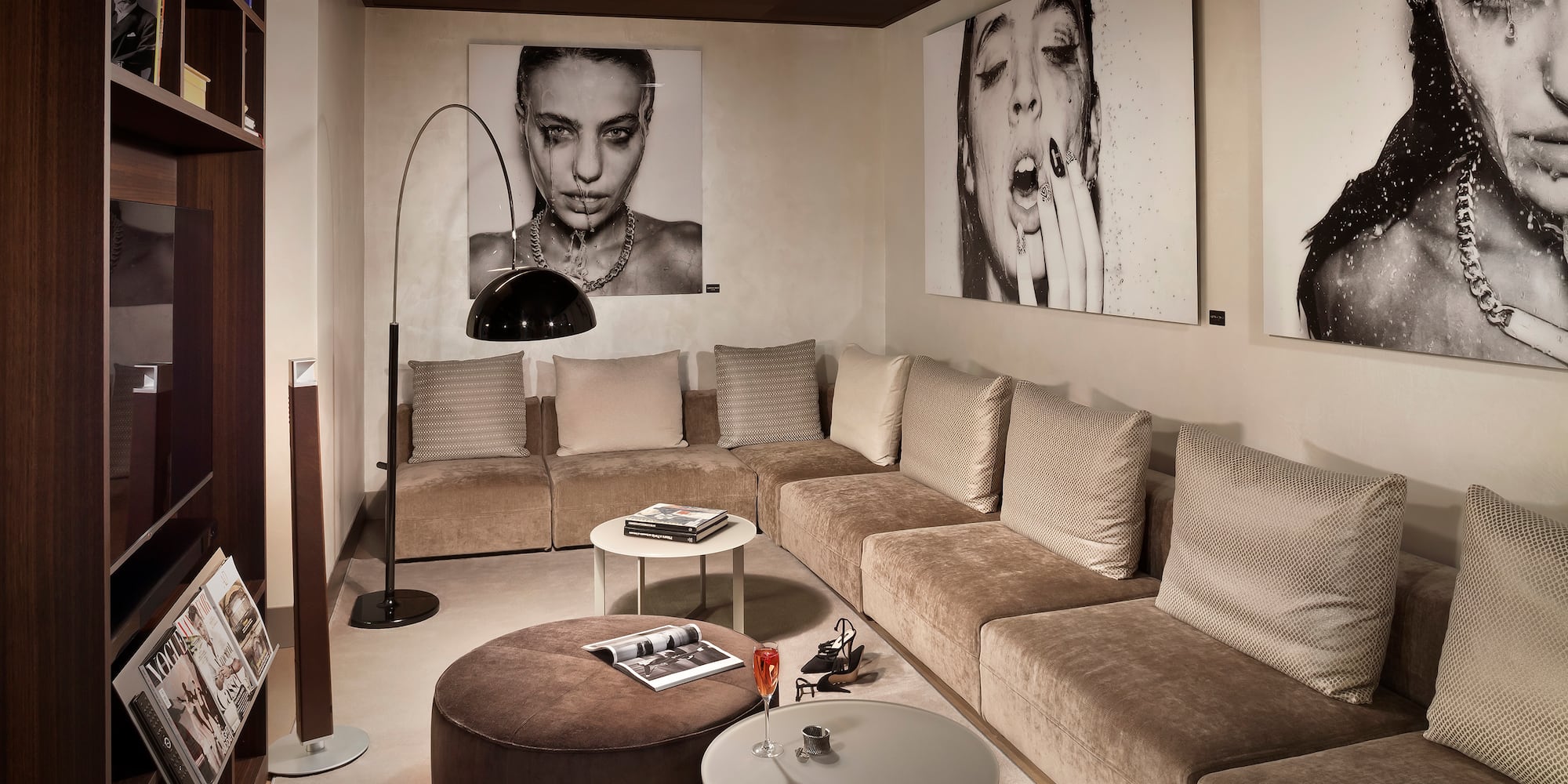 a living room with a couch and pictures on the wall