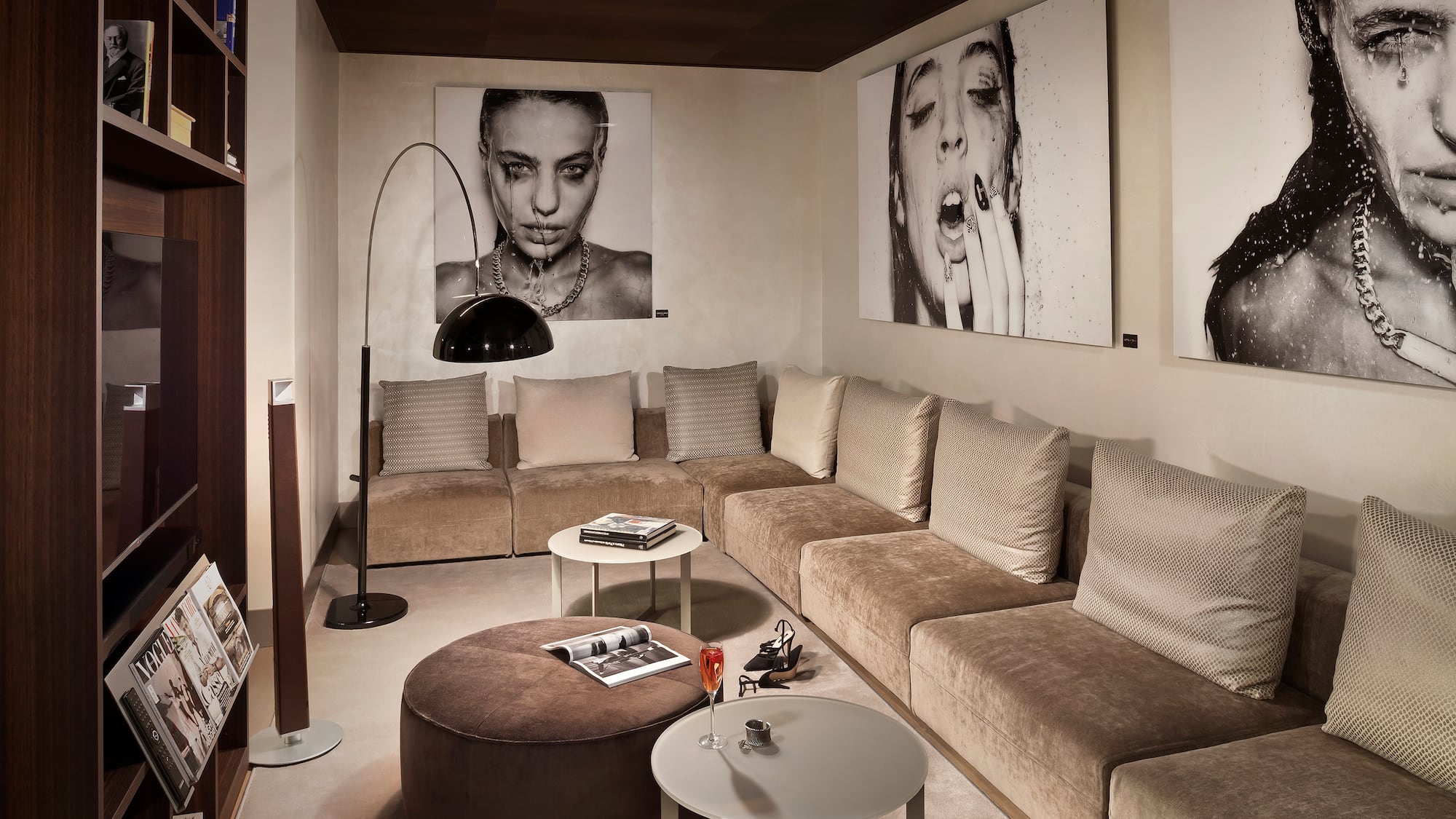a living room with a couch and pictures on the wall