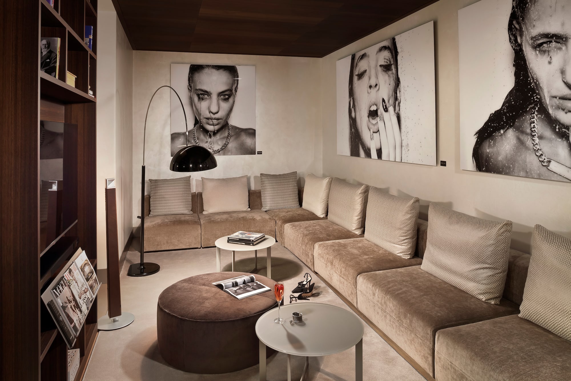 a living room with a couch and pictures on the wall