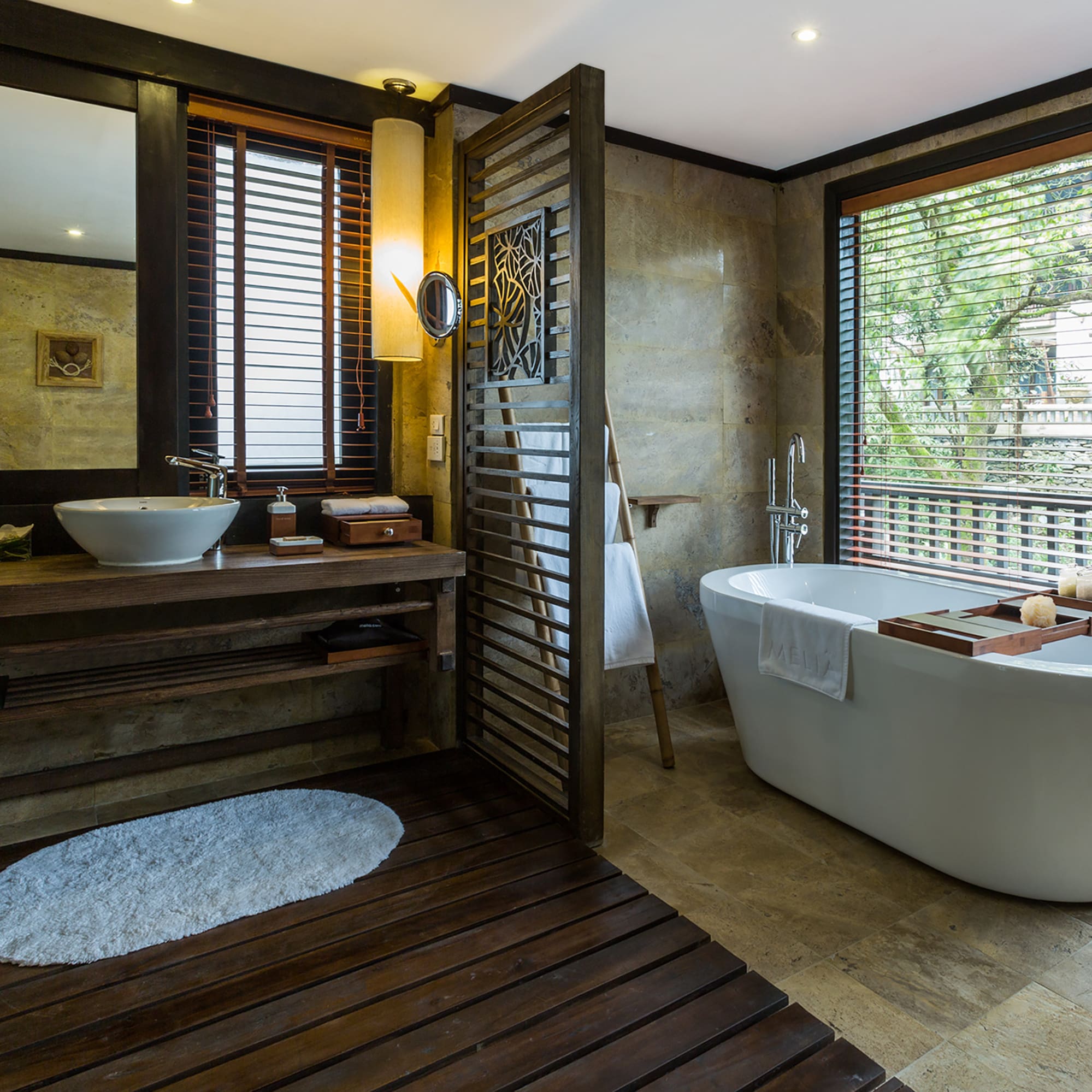 a bathroom with a tub and sink