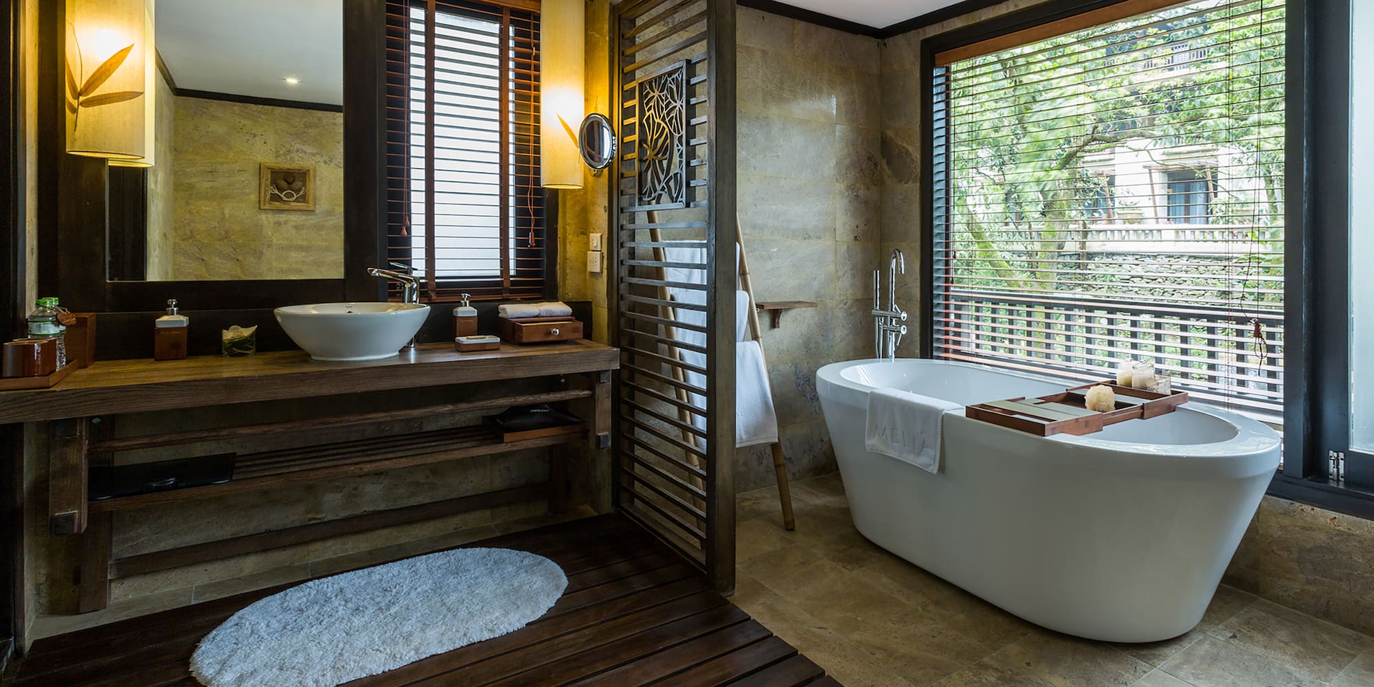 a bathroom with a tub and sink