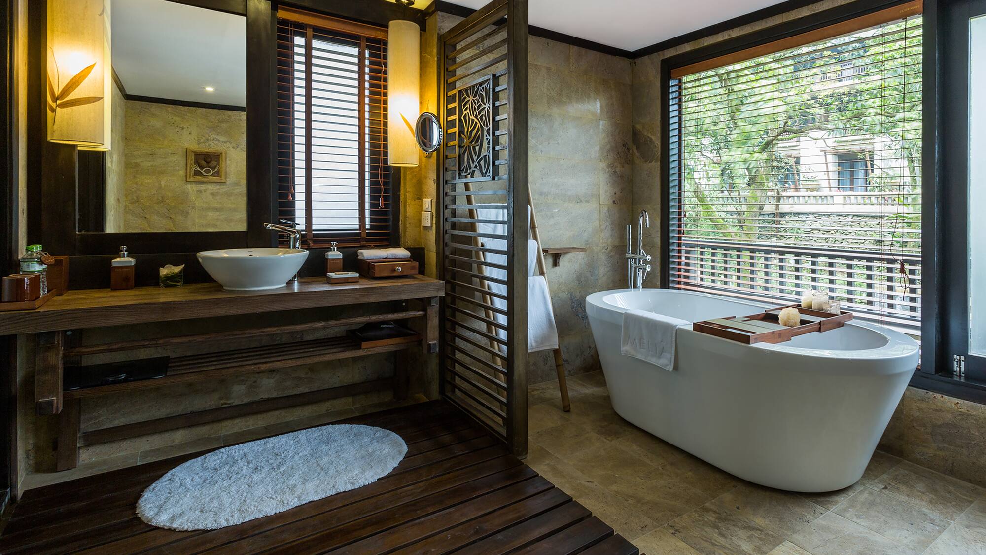 a bathroom with a tub and sink