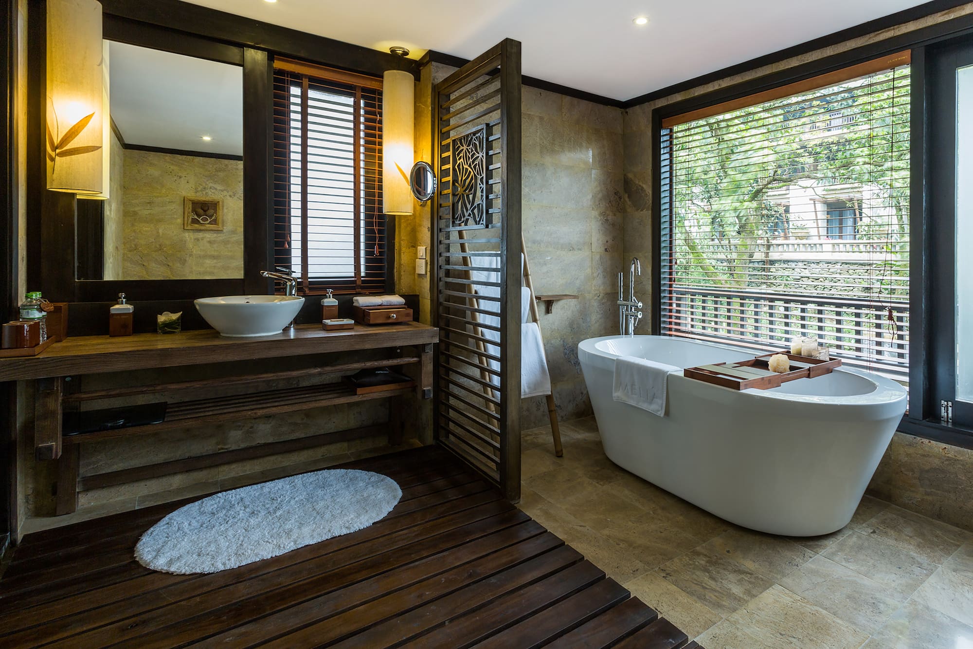a bathroom with a tub and sink
