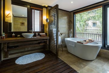 a bathroom with a tub and sink