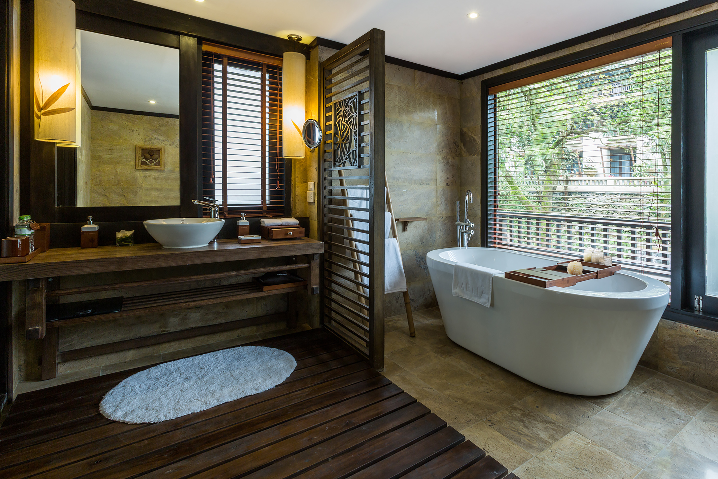a bathroom with a tub and sink