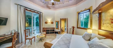 a room with a bed and a ceiling fan