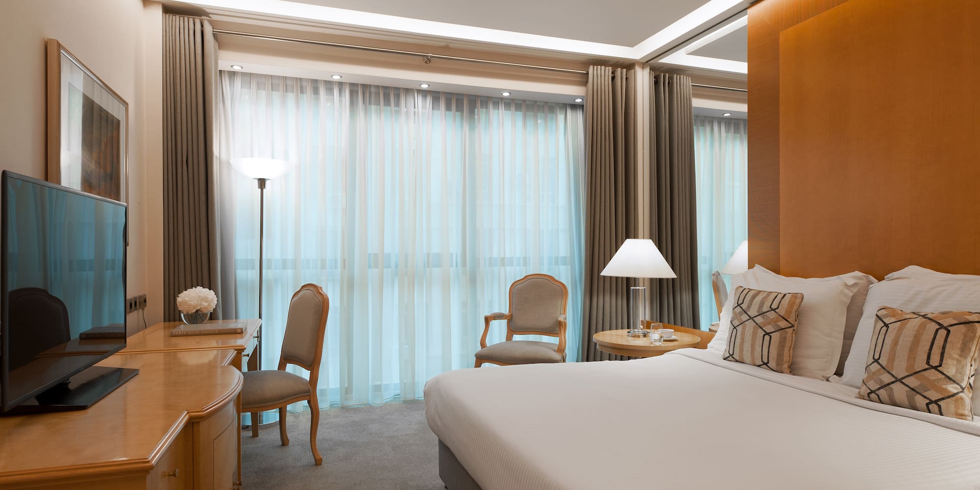 a bedroom with a bed and a desk