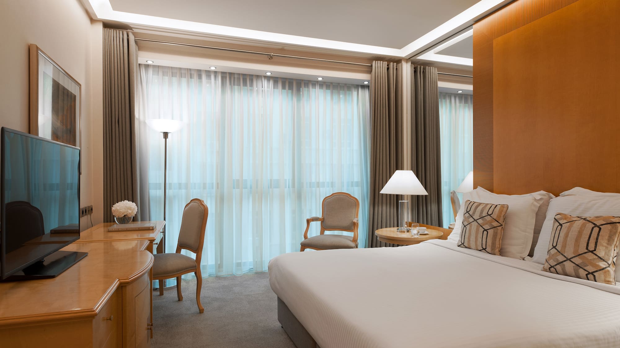 a bedroom with a bed and a desk