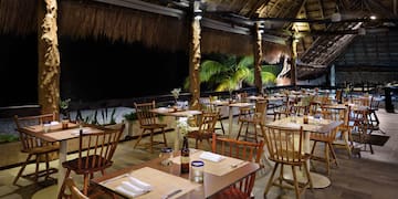 a restaurant with tables and chairs