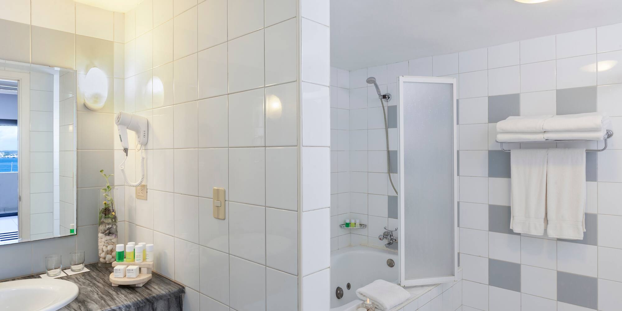 a bathroom with a sink and shower