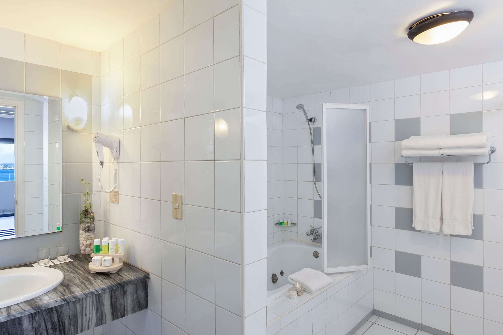 a bathroom with a sink and shower