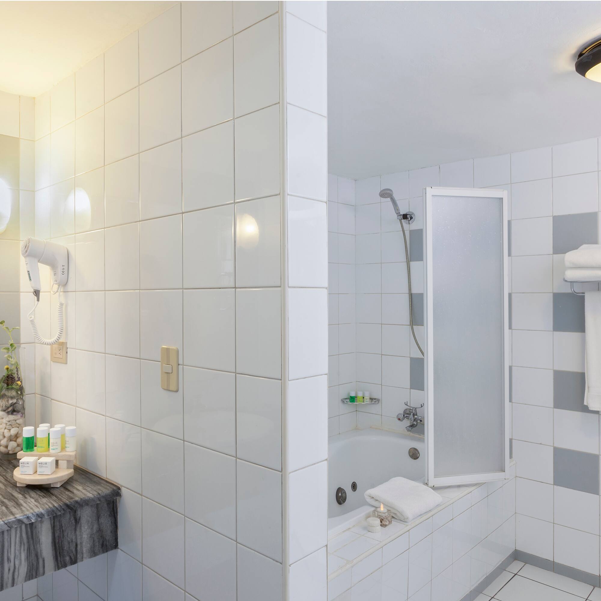 a bathroom with a sink and shower