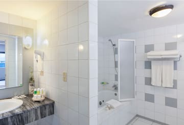 a bathroom with a sink and shower