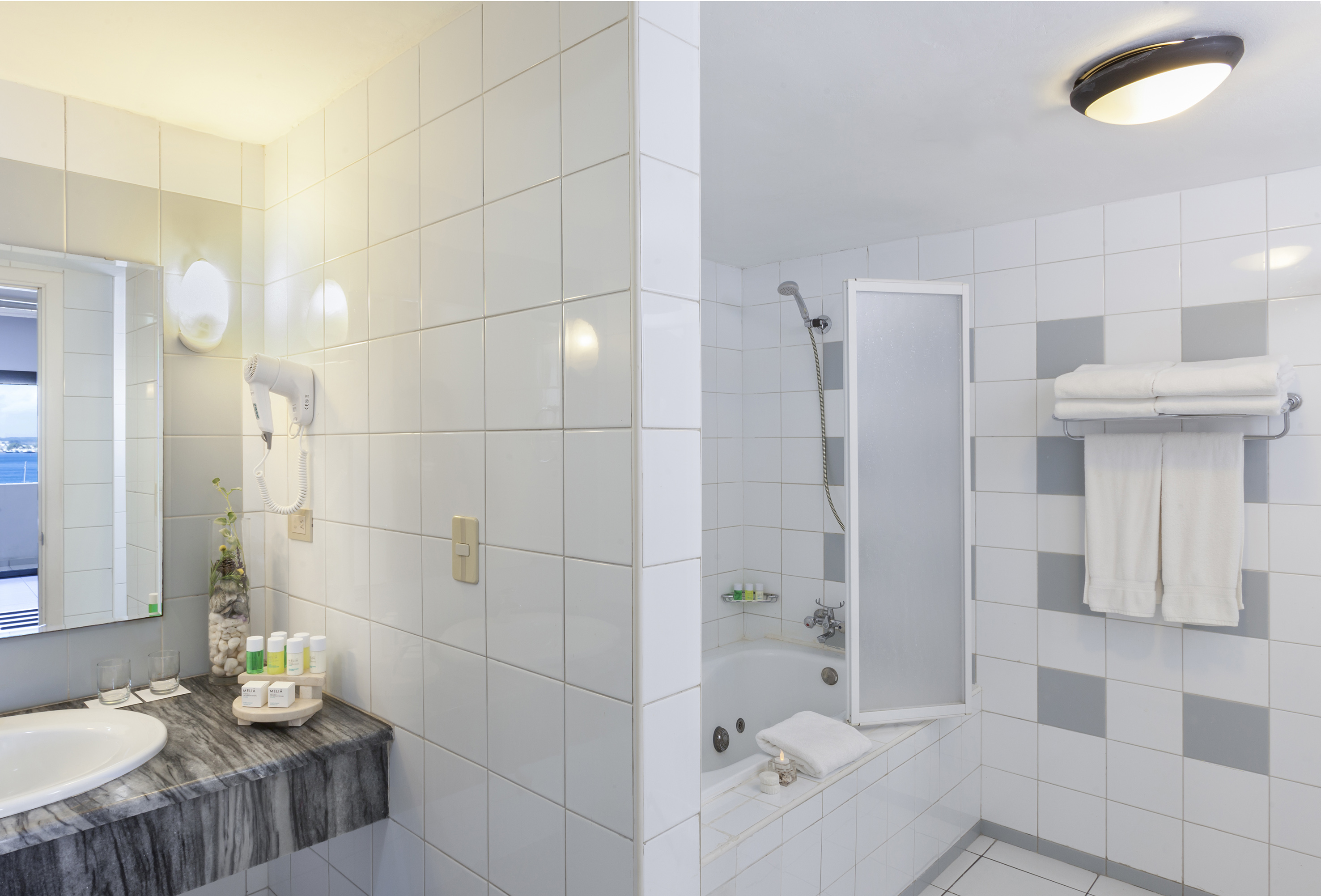 a bathroom with a sink and shower