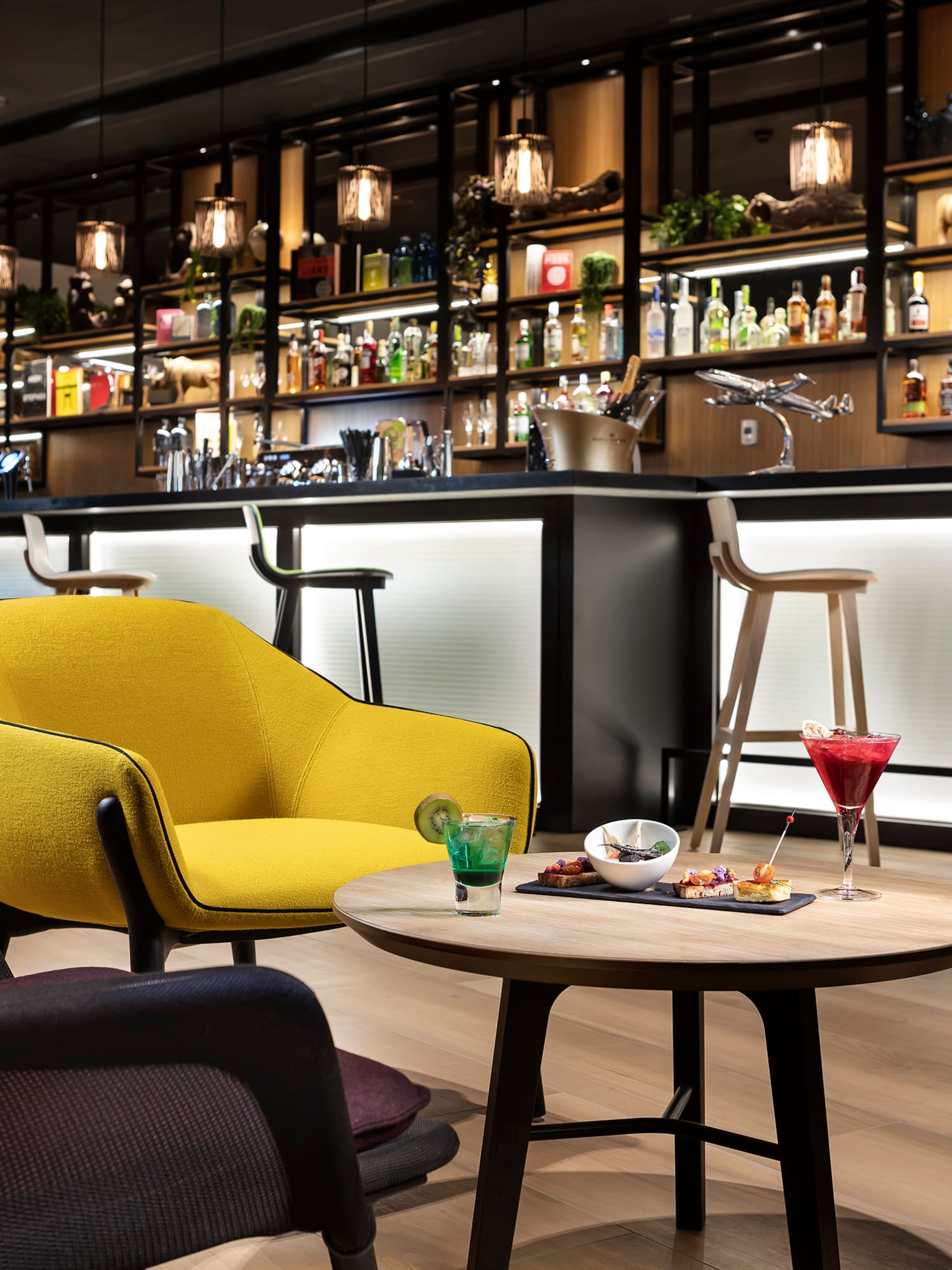 a bar with a table and chairs