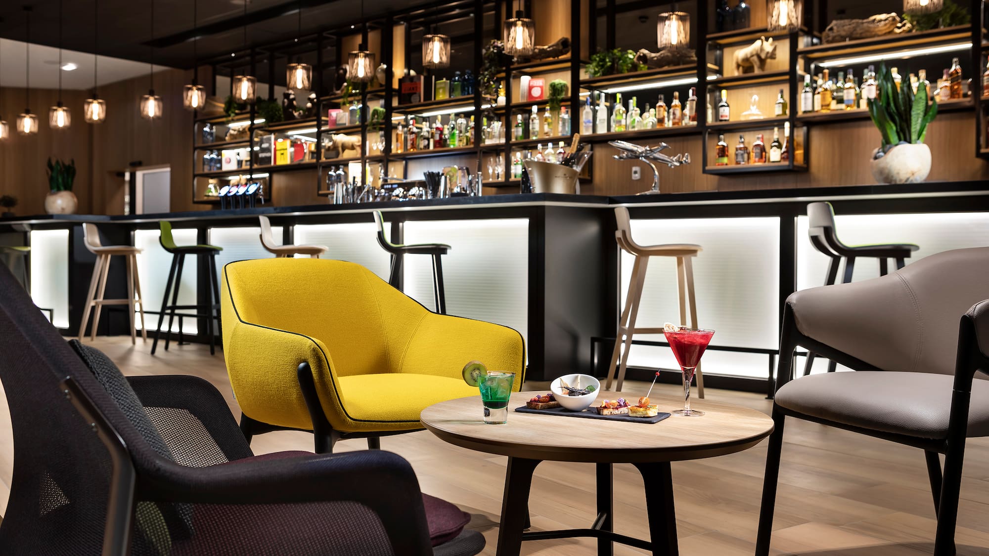 a bar with a table and chairs